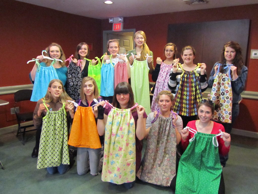 Pattern Pieces student group posing with their handmade dresses