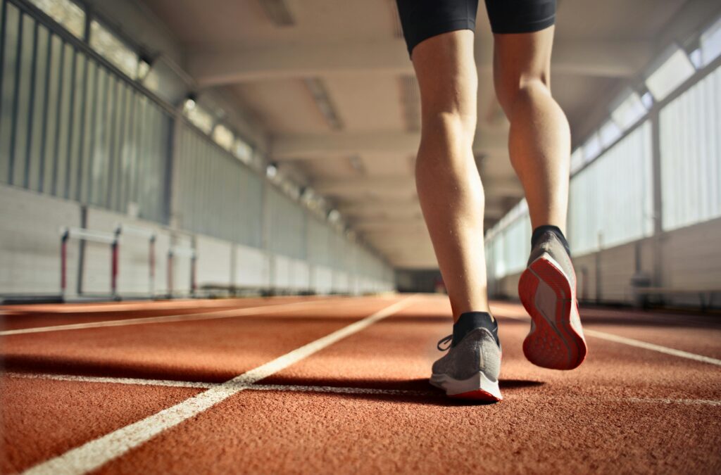 A person walking on an indoor track