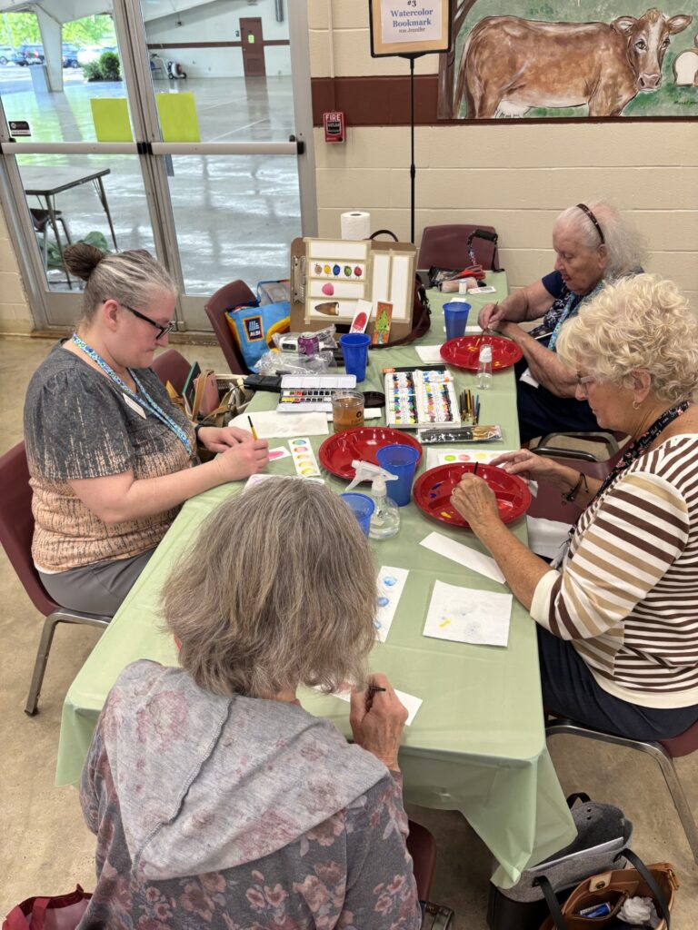 FCE ladies making bookmarks at day camp