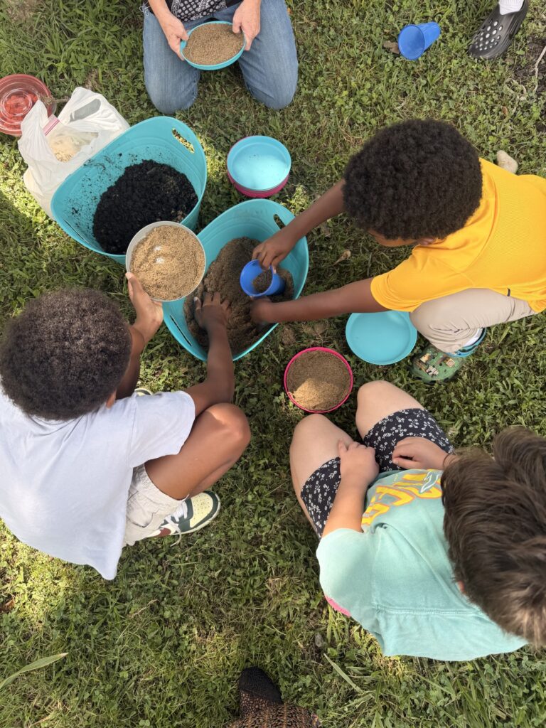 Kids choosing the base of a puddler pot