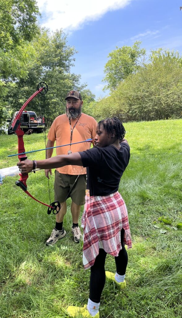 bow and arrow demonstration at wild child camp